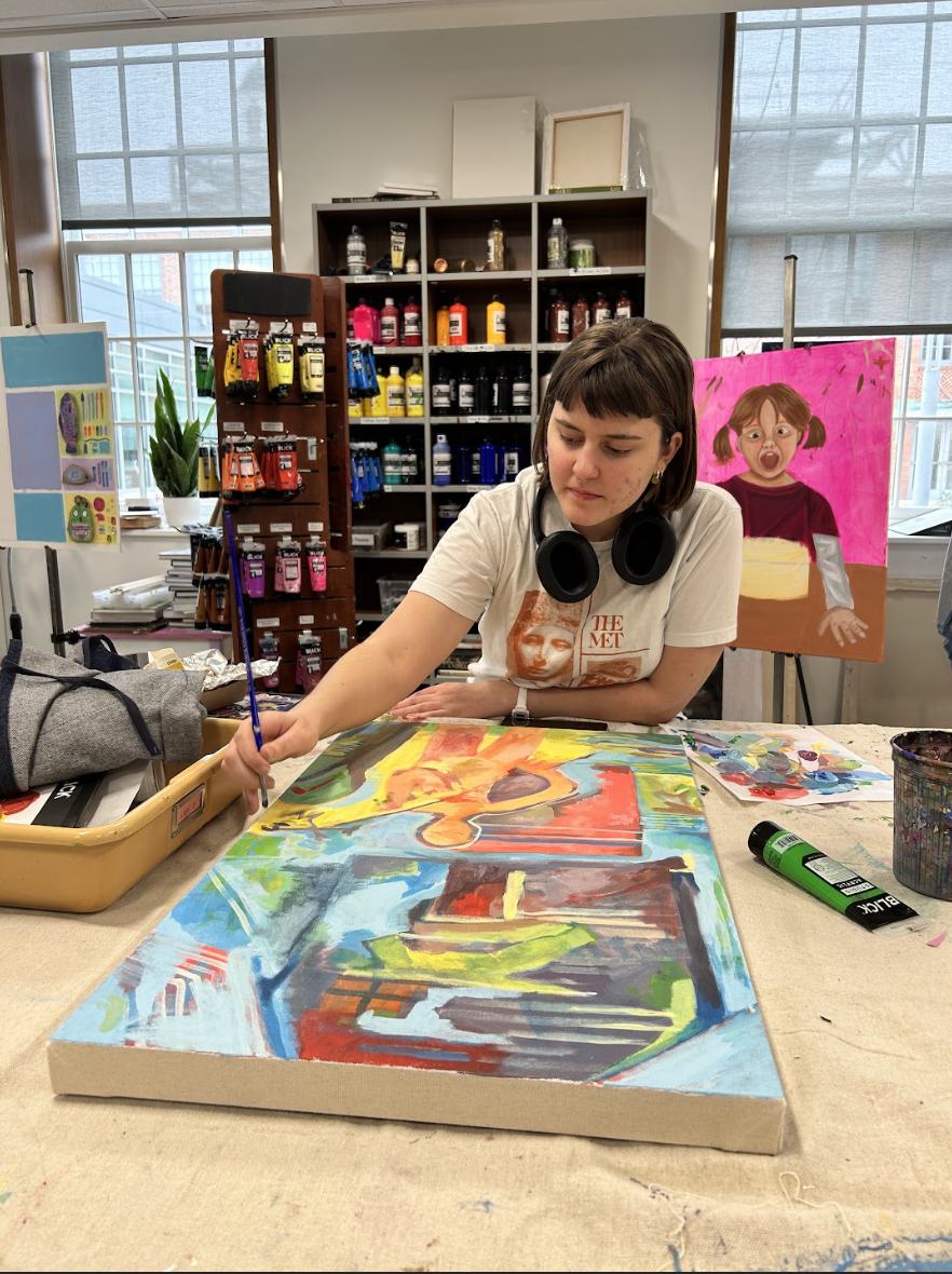 Gray Baker (11) adds finishing touches to her painting in AP Studio Art. Baker was inspired by frustrating conversations with people around her. "It's frustrating when people talk to me about my future knowing it doesn't include them in it," Gray Baker said.